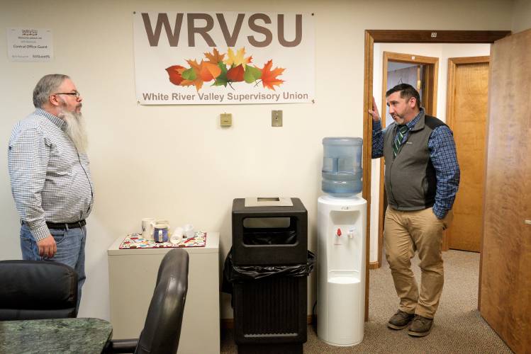 Jamie Kinnarney, superintendent of the White River Valley Supervisory Union, right, talks with Ray Ballou, director of technology and communications, left, after an information session on the impacts of Act 127 on school budgeting at the WRVSU offices in Royalton, Vt., on Friday, Feb. 23, 2024. Four members of the public attended via video conference. (Valley News - James M. Patterson) Copyright Valley News. May not be reprinted or used online without permission. Send requests to permission@vnews.com.