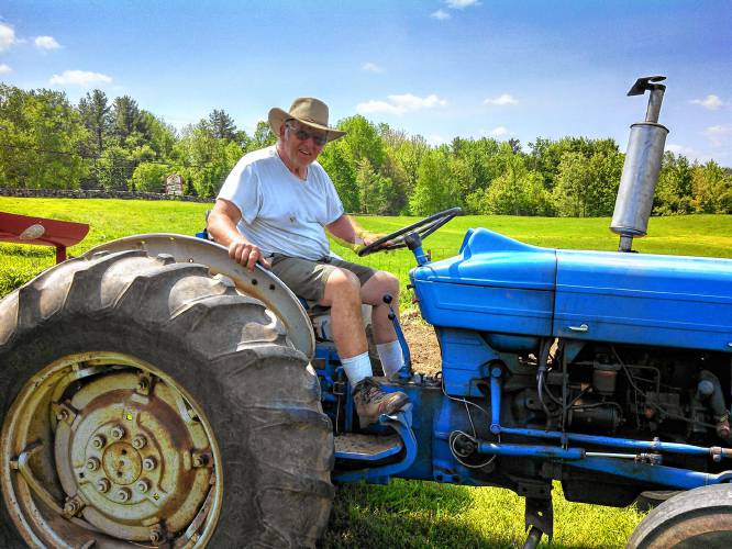 Richard Fabrizio on his tractor at the Windy Ridge Orchard in North Haverhill, N.H., in 2020. Fabrizio began planting apple trees in the 1960s and slowly built andan  orchard of more than 20 acres. (Family photograph)