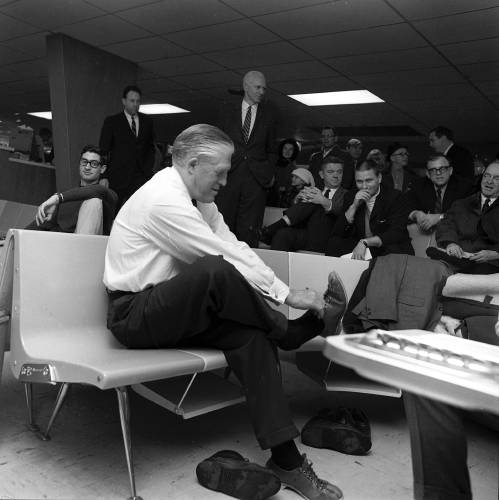 Gov. George Romney, R-Mich., puts on a pair of bowling shoes before playing a game for the media on Jan. 15, 1968, during a six-day, 2,000-mile campaign swing through New Hampshire before primary voting. (Valley News - Larry McDonald) Copyright Valley News. May not be reprinted or used online without permission. Send requests to permission@vnews.com.