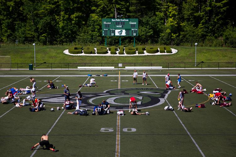 New Hampshire players stretch at the end of a practice for the Shrine Maple Sugar Bowl at Castleton University in Castleton, Vt., on Wednesday, August 3, 2022. (Valley News / Report For America - Alex Driehaus) Copyright Valley News. May not be reprinted or used online without permission. Send requests to permission@vnews.com.