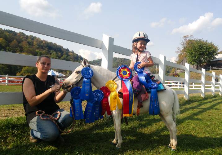 Christina Chatlos, left, poses with her daughter Hailey, 4, and miniature horse My Lemon with Whiskey at the Tunbridge World's Fair in Tunbridge, Vt., around 2017. Photo courtesy of Thomas Ferranti