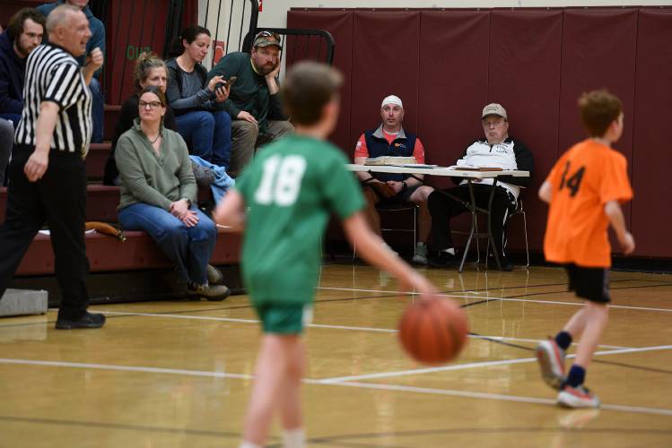 Jeremy Chiasson, left, and Paul Karp watch a basketball game on Thursday, March 14, 2024, in Lebanon, N.H. Chiasson is one of the directors of Karp’s Klassic, an end-of-the-season recreational basketball tournament which Karp founded. (Valley News - Jennifer Hauck) Copyright Valley News. May not be reprinted or used online without permission. Send requests to permission@vnews.com.