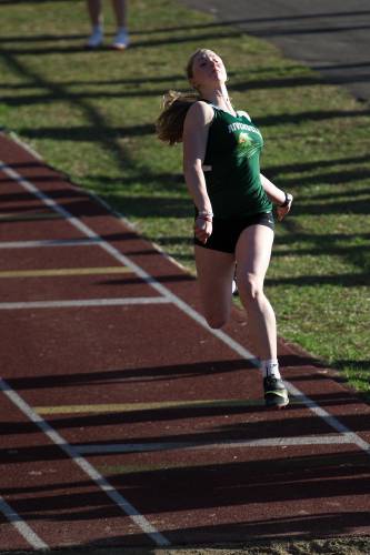 Sydney Schoenbeck, of Rivendell, sails to a win in the long jump with a distance of 4.89 meters during a meet in Windsor, Vt., on Tuesday, April 16, 2024. (Valley News - James M. Patterson) Copyright Valley News. May not be reprinted or used online without permission. Send requests to permission@vnews.com.