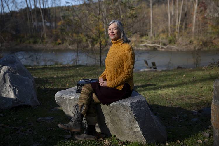Author Ann Aikens near her home in Bethel, Vt., on Tuesday, Oct. 31, 2023. Aikens, who started writing her column “Upper Valley Girl” in 1996, published a book of darkly comical advice for young women that she said no one gave her when she was growing up. (Valley News / Report For America - Alex Driehaus) Copyright Valley News. May not be reprinted or used online without permission. Send requests to permission@vnews.com.