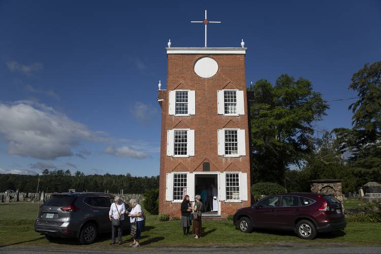 Parishioners linger outside after attending Mass at Old St. Mary Church in Claremont, N.H., on Saturday, August 26, 2023. (Valley News / Report For America - Alex Driehaus) Copyright Valley News. May not be reprinted or used online without permission. Send requests to permission@vnews.com.