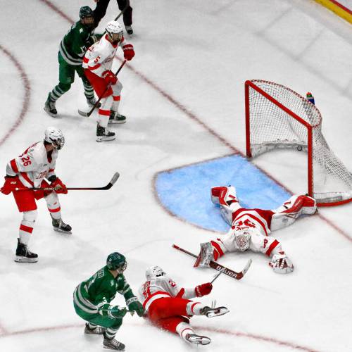 Dartmouth College's John Fusco (3) watches his second-period shot sail over Cornell goaltender Ian Shane to give the Big Green a 3-1 lead in the ECAC teams' playoff semifinal on March 22, 2024, at Herb Brooks Arena in Lake Placid, N.Y. Cornell won, 6-3. (Valley News - Tris Wykes) Copyright Valley News. May not be reprinted or used online without permission. 