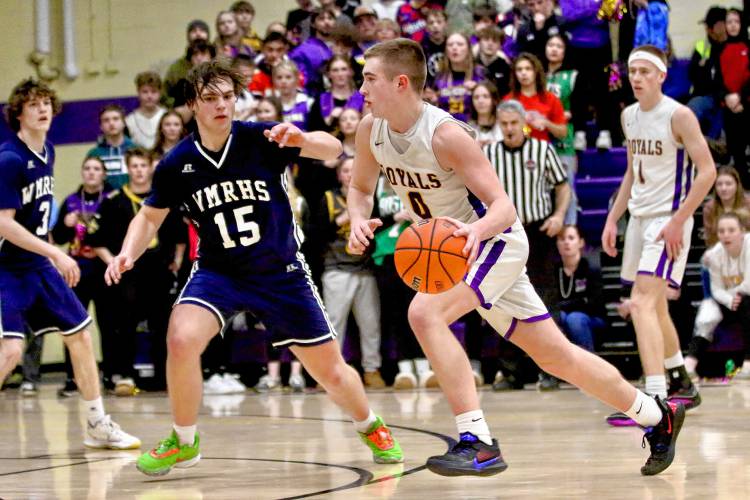 Mascoma High's Brayden Pierce dribbles against White Mountains foe Noah Covell during the NHIAA Division III teams' playoff quarterfinal game on Feb. 16, 2024, in West Canaan, N.H. Mascoma won, 62-59, in overtime on a Pierce shot at the buzzer. (Valley News - Tris Wykes) Copyright Valley News. May not be reprinted or used online without permission.