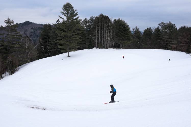 A thin patch of snow begins top open up as Braxton Chaffee, 9, of East Corinth, travels a popular line toward a jump on the Main Slope at Northeast Slopes in East Corinth, Vt., on Wednesday, Jan. 31, 2024. (Valley News - James M. Patterson) Copyright Valley News. May not be reprinted or used online without permission. Send requests to permission@vnews.com.