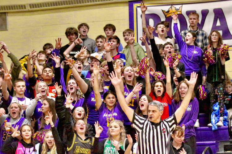 Mascoma High boys basketball fans cheer after a Royals basket during an NHIAA Division III playoff quarterfinal meeting with White Mountains. Mascoma won, 62-59, in overtime. (Valley News - Tris Wykes) Copyright Valley News. May not be reprinted or used online without permission.