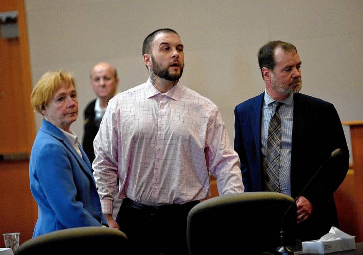 Adam Montgomery and his lawyers Caroline Smith and James Brooks watch as potential jurors enter the courtroom for jury selection ahead of his murder trial at Hillsborough County Superior Court in Manchester, N.H, on Tuesday, Feb. 6, 2024.  Montgomery is accused of killing his 5-year-old daughter and spending months moving her body before disposing of it.  (David Lane 