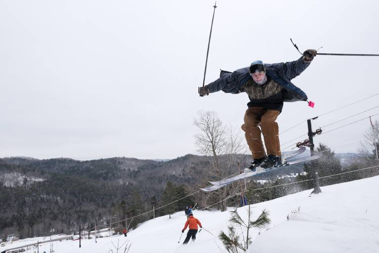 Gabe Limlaw, 16, of Corinth, does a 360 off a jump at Northeast Slopes in East Corinth, Vt., on Wednesday, Jan. 31, 2024. Several natural features provide the opportunity to catch air on the hillside, said volunteer instructor Tim Palmer. In his youth, Palmer recalls using “this little bump, that little bump, any little bump,” to build jumps on the hill. (Valley News - James M. Patterson) Copyright Valley News. May not be reprinted or used online without permission. Send requests to permission@vnews.com.