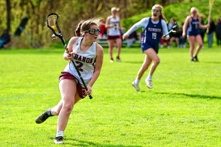 Lebanon High's Sara Forman runs upfield against Plymouth on May 1, 2023, during the NHIAA Division III teams' meeting in Lebanon, N.H.  (Valley News - Tris Wykes) Copyright Valley News. May not be reprinted or used online without permission. Send requests to permission@vnews.com.