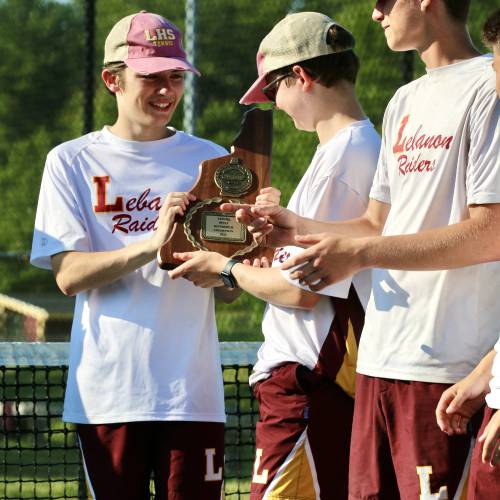 Lebanon High's Finn Ericson, left, admires the NHIAA Division II championship plaque with Bayden Schifferdecker after their tennis team's 7-2 defeat of Bow on May 31, 2023, at Alvirne High in Hudson, N.H. (Valley News - Tris Wykes) Copyright Valley News. May not be reprinted or used online without permission. Send requests to permission@vnews.com. 