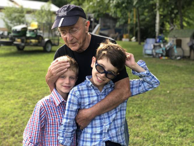 Al Pristaw with his grandsons, Oscar, left, and Charles outside his home in Riverside Park. Photo by Josh Pristaw