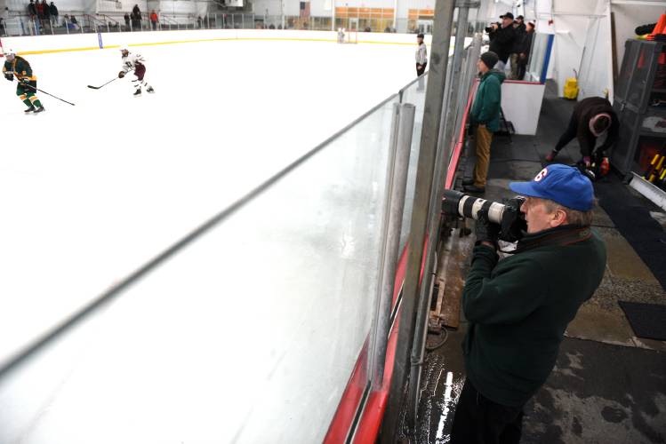 Larry Vanier photographs the Hanover girls hockey game in West Lebanon, N.H. on Saturday, Feb. 17, 2024. In addition to photographing landscapes for about the last 40 years, Vanier attends and photographs local events, including games and concerts. (Valley News - Jennifer Hauck) Copyright Valley News. May not be reprinted or used online without permission. Send requests to permission@vnews.com.