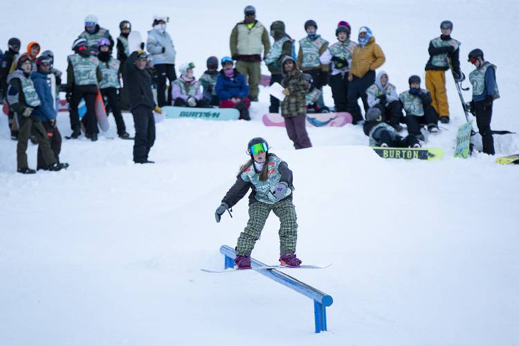 Woodstock’s Bonnie Kranz slides down a rail during a snowboard meet at Whaleback Mountain in Enfield, N.H., on Tuesday, Feb. 6, 2024. Riders were judged based on their creativity and use of the course’s features. (Valley News / Report For America - Alex Driehaus) Copyright Valley News. May not be reprinted or used online without permission. Send requests to permission@vnews.com.