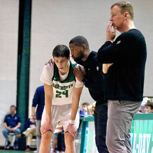 Dartmouth College's Niko Abusara, left, listens to assistant coach Jabari Trotter. Big Green head coach David McLaughlin is at right during his team's 82-69 loss to Ivy League rival Penn. (Valley News - Tris Wykes) Copyright Valley News. May not be reprinted or used online without permission. —Tris Wykes valley news photographs — Tris Wykes