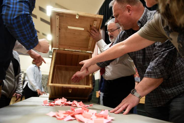As Town Moderator Gary Hebertempties a ballot box, counters Marie and Matthew Bjelobrk point out a few votes left behind in the box. Voters were casting a ‘yes’ or ‘no’ vote for the article on SB2 on Saturday, March 16, 2024 in Haverhill, N.H. (Valley News - Jennifer Hauck) Copyright Valley News. May not be reprinted or used online without permission. Send requests to permission@vnews.com.