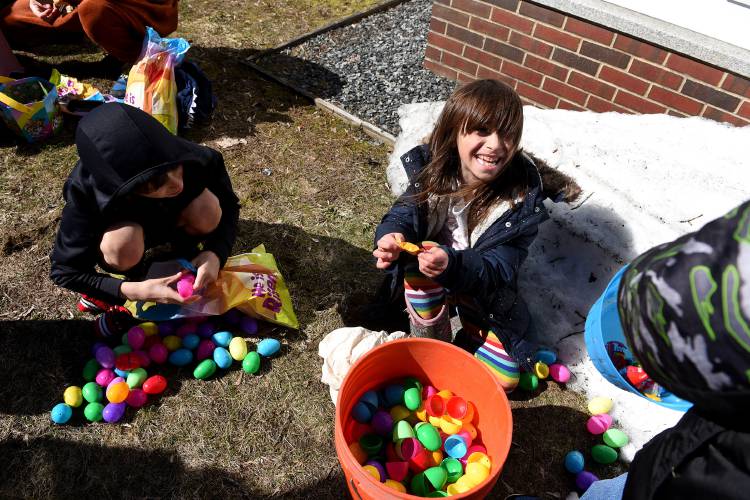 Lev Burakian, 9, left and his sister Ani, 6, of Brownsville, Vt.,sort out their candy after the East Egg Hunt at the Brownsville Community Church on Saturday, April 8, 2023 in Brownsville. After the hunt children take whatever treat is in the egg and leave the plastic eggs for next year's hunt. (Valley News - Jennifer Hauck) Copyright Valley News. May not be reprinted or used online without permission. Send requests to permission@vnews.com.