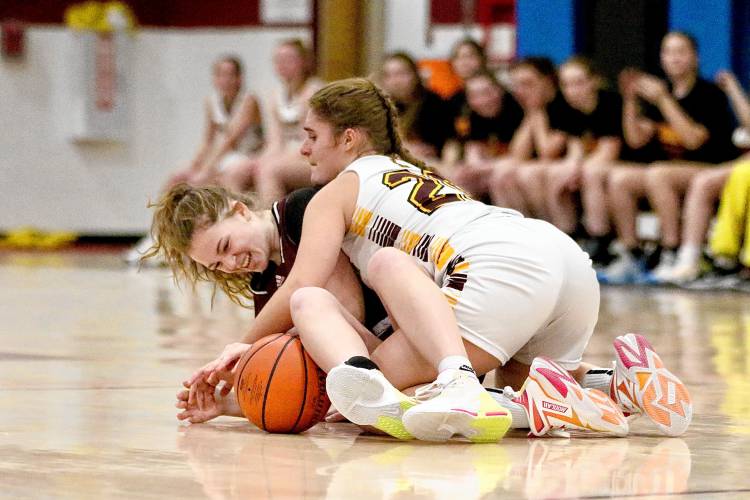 Lebanon High's Sarah Belk, right, wrestles with Timberlane's Cecilia Penny during the NHIAA Division II teams' Feb. 15, 2024, game in Lebanon, N.H. Timberlane won, 47-39, in overtime. (Valley News - Tris Wykes) Copyright Valley News. May not be reprinted or used online without permission.