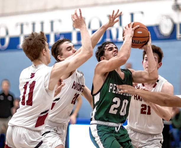Pembroke guard Joe Fitzgerald (20) is surrounded by four Hanover players as he attempts to go to the basket during the second half of the Division II semifinal game at Oyster River High School on Tuesday night, March 5, 2024.