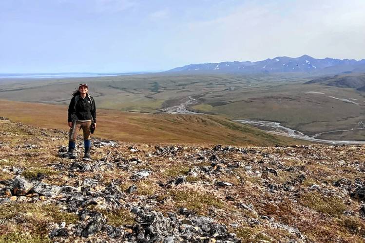 Joanmarie Del Vecchio, then a Neukom Postdoctoral Fellow, leads a hike in Alaska to study why Arctic watersheds have less river area. (Courtesy Dartmouth College)