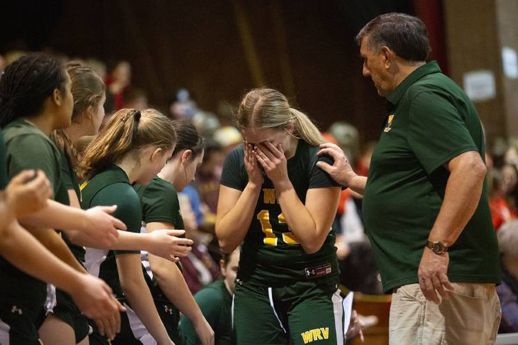 White River Valley head coach Gordon Barnaby consoles Olivia Tuller (13) as she exits the court during a VPA D-III girls basketball semifinal game against Hazen at Barre Auditorium in Barre, Vt., on Thursday, March 7, 2024. Hazen won, 70-49. (Valley News / Report For America - Alex Driehaus) Copyright Valley News. May not be reprinted or used online without permission. Send requests to permission@vnews.com.