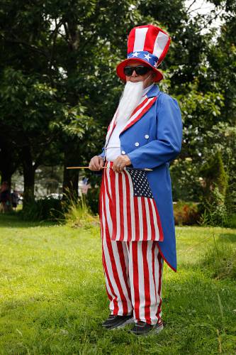 John Yacavone, of Meriden, N.H., waits for the start of the 38th annual Fourth of July parade in Plainfield, N.H., on July 4, 2019. As Uncle Sam, Yacovone has led the parade for the past six years. (Valley News - Geoff Hansen) Copyright Valley News. May not be reprinted or used online without permission. Send requests to permission@vnews.com.
