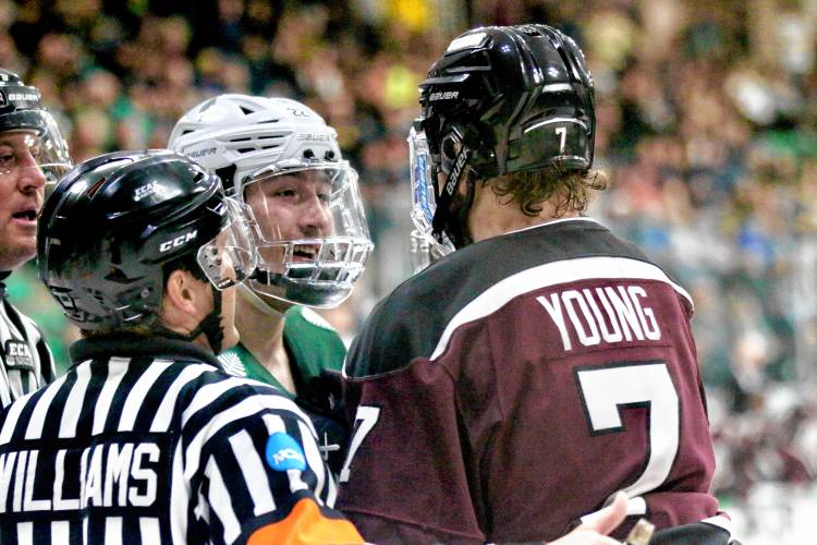 Union College's Nick Young and Dartmouth's Trym Løkkeberg exchange words after a whistle during the ECAC teams' quarterfinal playoff game on March 16, 2024, at Thompson Arena in Hanover, N.H. Dartmouth won, 4-2, to sweep the best-of-three series and advance to the semifinals in Lake Placid, N.Y. Valley News - Tris Wykes) Copyright Valley News. May not be reprinted or used online without permission. 