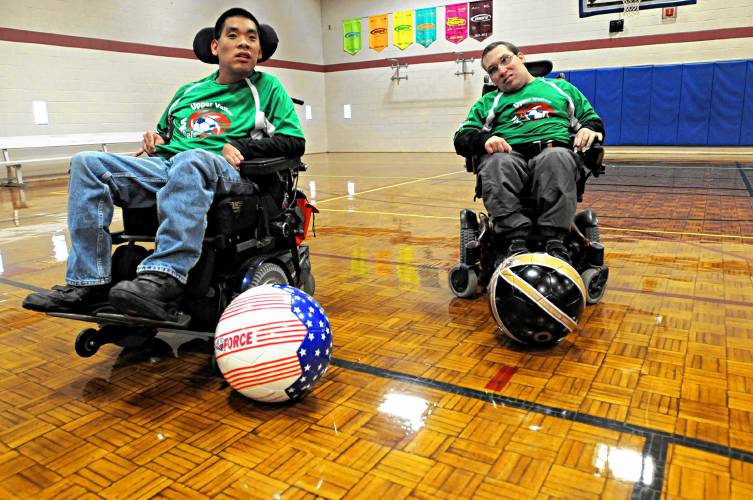 C.J. Lanzim, of Plainfield, N.H., right, and, Jamie Lowery, of Wilder, Vt., are part of the Upper Valley Power Soccer team at the Witherell Recreation Center in Lebanon, N.H., on Oct. 10, 2013. The team also plays in Burlington and Massachusetts. (Valley News - Jennifer Hauck) Copyright Valley News. May not be reprinted or used online without permission. Send requests to permission@vnews.com.