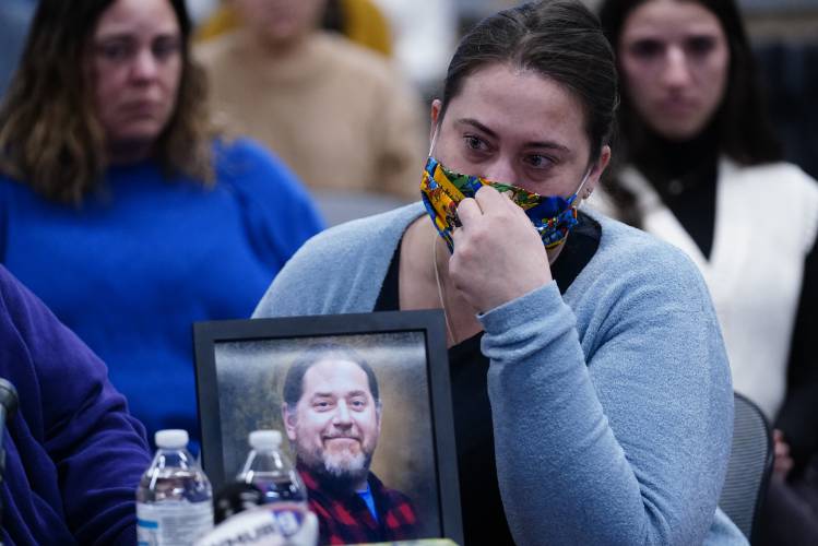 Rachael Sloat, fiance of victim Peyton Brewer Ross, in framed photo, testifies, Thursday, Feb. 1, 2024, in Augusta, Maine, during a hearing of the independent commission investigating the law enforcement response to the mass shooting in Lewiston, Maine. (AP Photo/Robert F. Bukaty)