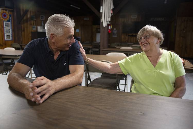 Paul Mitiguy, left, of Menlo Park, Calif., and June Partridge, of Enfield, N.H., talk about their memories of the Bethany House summer program at the Shrine of Our Lady of La Salette in Enfield, N.H., on Friday, Sept. 8, 2023. For nearly a decade, Partridge and her husband welcomed a group of 20 boys, including Mitiguy, to stay with them at the shrine for a summer where they learned to farm and spent time in prayer with lay and religious members of the community. “The longevity of the relationships, the depth of the relationships…is just amazing,” said Mitiguy, who has continued to return to Enfield nearly every summer. “It was the highlight of my life,” Partridge said. (Valley News / Report For America - Alex Driehaus) Copyright Valley News. May not be reprinted or used online without permission. Send requests to permission@vnews.com.