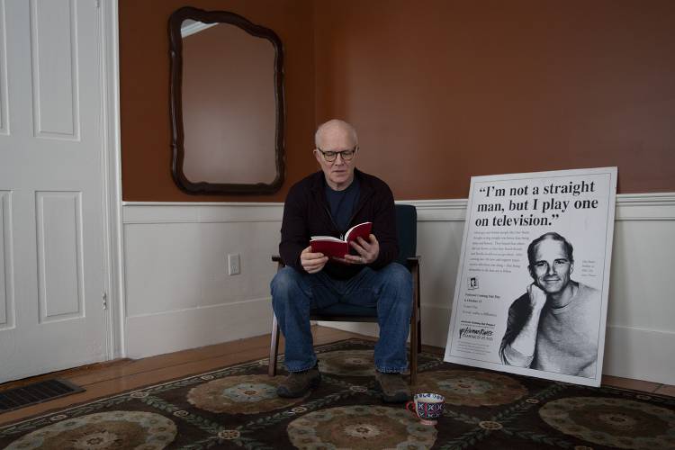 Dan Butler looks through a copy of his one-man play “The Only Thing Worse You Could Have Told Me” at his home in Newbury, Vt., on Wednesday, Dec. 6, 2023. Butler will be performing the play, which premiered in 1994 and is comprised of 10 vignettes that depict a spectrum of gay experiences at that time, on Sunday at 4 p.m. in Haverhill’s Alumni Hall to raise money for the nonprofit Help Kids India. (Valley News / Report For America - Alex Driehaus) Copyright Valley News. May not be reprinted or used online without permission. Send requests to permission@vnews.com.