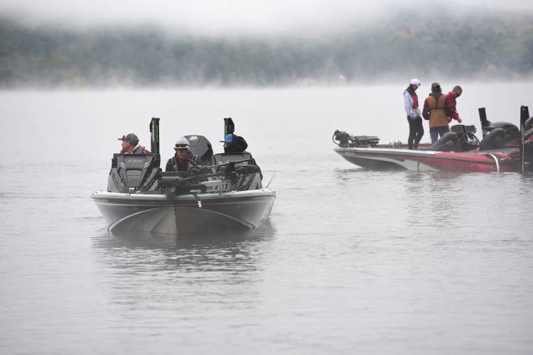 
The Mascoma bass fishing team of Tanner Moulton, middle, and Peyton Sargent heads out onto Mascoma Lake with coach Eric Moulton for the NHIAA state bass fishing championship on Saturday, Oct. 1, 2022, in Enfield, N.H. (Valley News - Jennifer Hauck) Copyright Valley News. May not be reprinted or used online without permission. Send requests to permission@vnews.com.