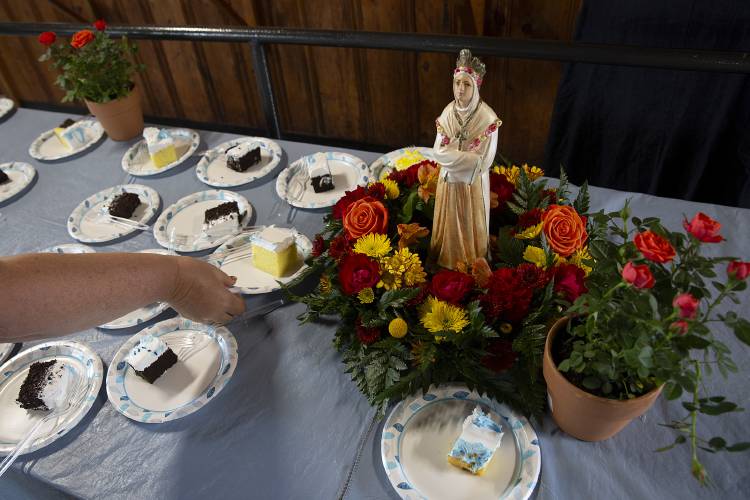 A statue of Our Lady of La Salette watches over a table of sheet cake following a Mass celebrating the feast of Our Lady of La Salette at the Shrine of Our Lady of La Salette in Enfield, N.H., on Sunday, Sept. 17, 2023. (Valley News / Report For America - Alex Driehaus) Copyright Valley News. May not be reprinted or used online without permission. Send requests to permission@vnews.com.