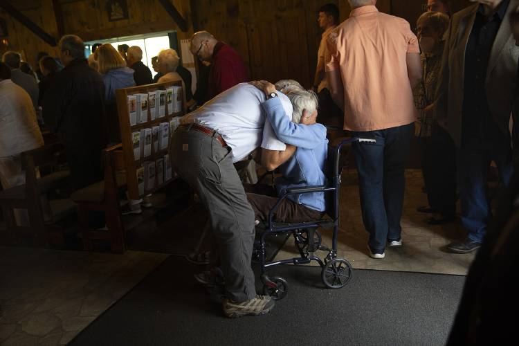 Associate John Markowitz, left, of Enfield, N.H., hugs Virginia Brown, of Wolfeboro, N.H., during a Mass celebrating the feast of Our Lady of La Salette at the Shrine of Our Lady of La Salette in Enfield, N.H., on Sunday, Sept. 17, 2023. Brown invited Markowitz and his wife Sharon up to visit the shrine with her in 1979, setting in motion the family’s move to Enfield the following year. (Valley News / Report For America - Alex Driehaus) Copyright Valley News. May not be reprinted or used online without permission. Send requests to permission@vnews.com.