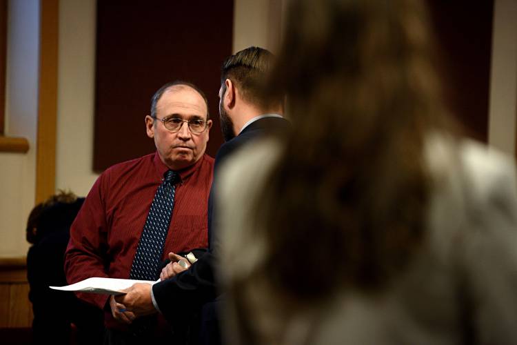 Dean Stearns, left, the former Principal of South Royalton School, speaks to his attorney Michael Shane after his change of plea in Windsor County Superior Court in White River Junction, Vt., on Dec. 11, 2018. Stearns pleaded guilty to surreptitiously recording five teenage girls while they were staying at his Sharon home. (Valley News - Jennifer Hauck) Copyright Valley News. May not be reprinted or used online without permission. Send requests to permission@vnews.com.