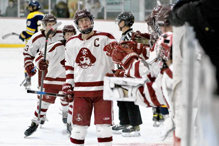 Hanover High's Jack Wilkinson celebrates with teammates on the bench at Campion Rink after scoring during his NHIAA Division I team's 5-4 defeat of Nashua North-Souhegan on Feb. 14, 2024, in West Lebanon, N.H. 