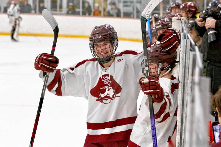 Hanover High's Henry Cotter, left, and Wyatt Seelig celebrate a Bears goal during their team's 5-4 NHIAA Division I defeat of Nashua North-Souhegan on Feb. 14, 2024, at Campion Rink in West Lebanon, N.H.  (Valley News - Tris Wykes) Copyright Valley News. May not be reprinted or used online without permission.