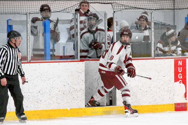 Hanover High's Henry Cotter steps out of the penalty box, leaving a pair of teammates behind, during the Bears' 5-4 defeat of NHIAA Division I foe Nashua North-Souhegan on Feb. 14, 2024, at Campion Rink in West Lebanon, N.H. The teams combined for 22 penalties during a game that lasted 2 1/2 hours.  (Valley News - Tris Wykes) Copyright Valley News. May not be reprinted or used online without permission.