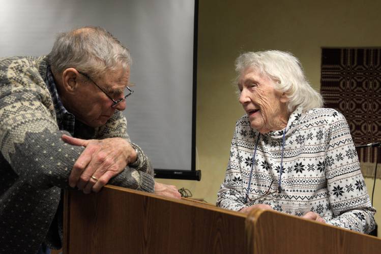 Dorothy Whitney Yamashita, 98, right, talks with fellow Harvest Hill resident James Hughes, 92, left, after her presentation about her husband, Kanshi Stanley Yamashita, and Japanese-Americans during World War II in Lebanon, N.H., on Tuesday, Feb. 20, 2024. (Valley News - James M. Patterson) Copyright Valley News. May not be reprinted or used online without permission. Send requests to permission@vnews.com.