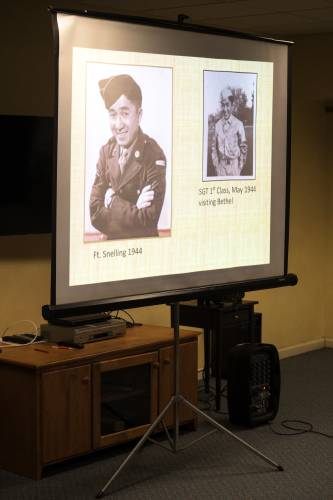 During her talk to pay tribute to the Japanese-American community at Harvest Hill assisted living in Lebanon, N.H., Dorothy Whitney Yamashita projected photographs of her husband Kanshi Stanley Yamashita, on Wednesday, Feb. 21, 2024. The couple met at Antioch College in Ohio after Yamashita served as an enlisted Army interpreter for Japanese prisoners of war in the Philippines during World War II, and married in 1950. He went on to a 30-year career in military intelligence. (Valley News - James M. Patterson) Copyright Valley News. May not be reprinted or used online without permission. Send requests to permission@vnews.com.