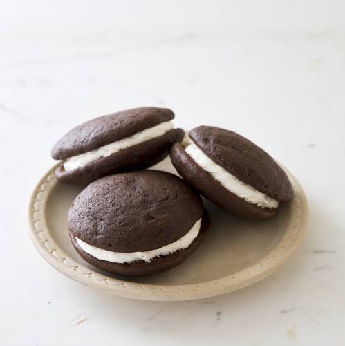 This undated photo provided by America's Test Kitchen in May 2018 shows whoopie pies in Brookline, Mass. This recipe appears in the cookbook “The Perfect Cookie.” (Joe Keller/America's Test Kitchen via AP) 