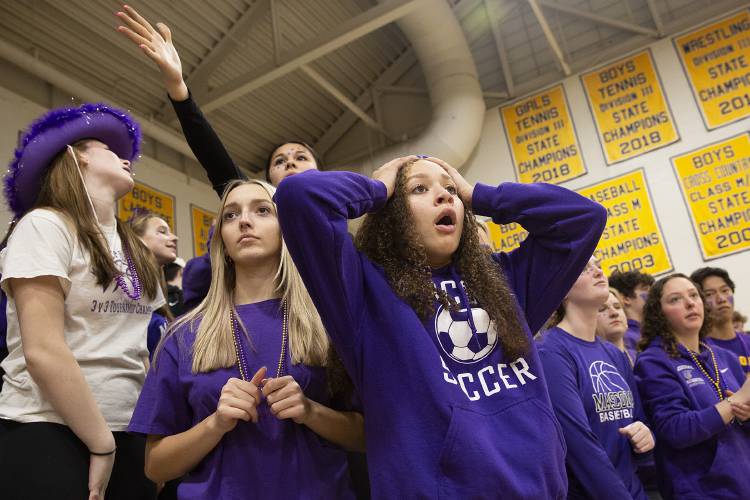 Members of the Mascoma student section, clockwise from left, Aaliyah Muzzey, 14, Aubrey Meyveagaci, 15, Alexis Patterson, 17, and Talyn Schmidt, 17, react during the NHIAA Division III boys basketball semifinal game against St. Thomas Aquinas High School held at Bow High School in Bow, N.H., on Tuesday, Feb. 20, 2024. (Valley News / Report For America - Alex Driehaus) Copyright Valley News. May not be reprinted or used online without permission. Send requests to permission@vnews.com.