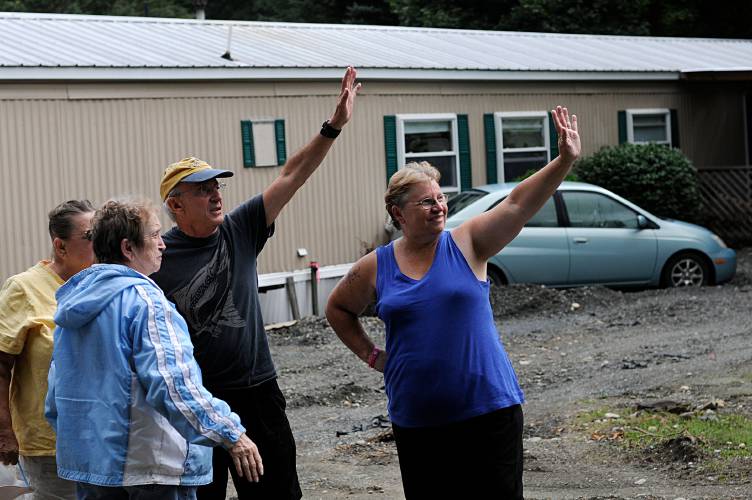 Riverside Mobile Home Park residents from left, Pauline Holt, Sue Esty, Al Pristaw and Ethel Davis wave goodbye to Vermont Governor Peter Shumlin in Woodstock, Vt., on Sept. 6, 2011, after a his short visit to the park that was heavily damaged by flooding from the Ottauquechee River during Tropical Storm Irene. (Valley News - James M. Patterson) Copyright Valley News. May not be reprinted or used online without permission. Send requests to permission@vnews.com.