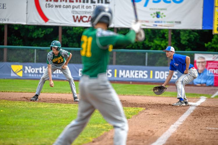 White River Valley's Wyatt Cadwell takes a lead off first as Thetford's Justin Robinson covers the base Saturday in the D-III championship game in Burlington. (Tim Calabro / White River Valley Herald)