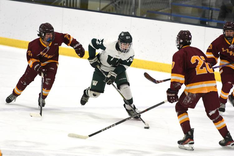 Lebanon's Benjamin Fogg (23) and teammate Keegan Dannehy (20) move towards Woodstock's Griffin Picconi during the Philippe H. Bouthillier Holiday Classic hockey tournament in White River Junction, Vt., on Wednesday, Dec. 27, 2023, in White River Junction, Vt. Lebanon won, 4-0.  (Valley News - Jennifer Hauck) Copyright Valley News. May not be reprinted or used online without permission. Send requests to permission@vnews.com.