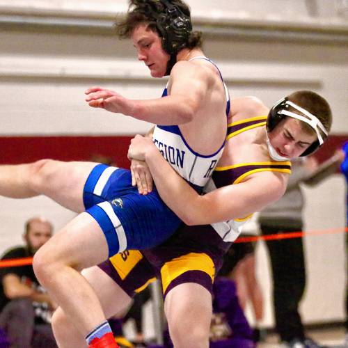 Mascoma High's Lincoln Butterfield throws Max Demaine, a Lake Region student competing for St. Johnsbury, during their 175-pound wrestling bout on Dec. 30, 2023, in Lebanon, N.H. Demaine later pinned Butterfield to win the match at a 17-team tournament hosted by Lebanon High. (Valley News - Tris Wykes) Copyright Valley News. May not be reprinted or used online without permission. Send requests to permission@vnews.com.