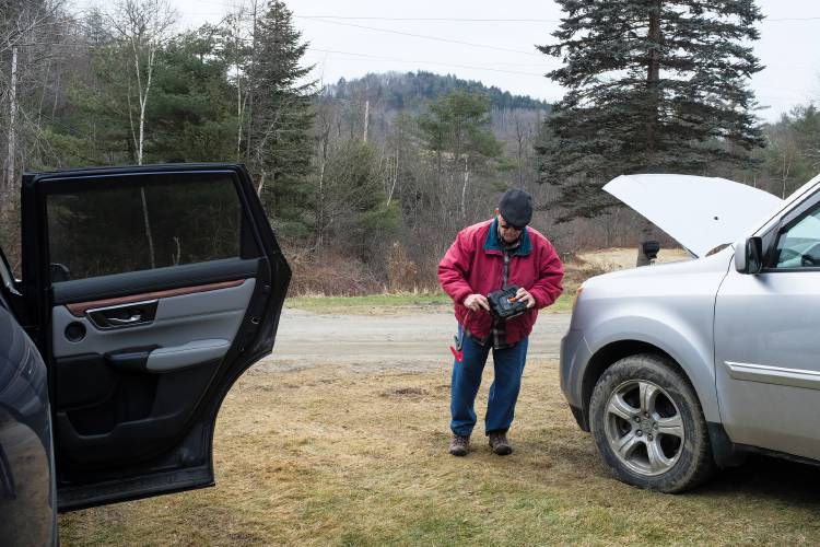 Ron Thomas, 80, wraps up the cords of his jump pack after trying to start his vehicle outside his Sharon, Vt., home on Wednesday, Jan. 3, 2024. The newly installed battery was loshing charge, but Thomas was able to start the engine after hooking up a charger. (Valley News - James M. Patterson) Copyright Valley News. May not be reprinted or used online without permission. Send requests to permission@vnews.com.