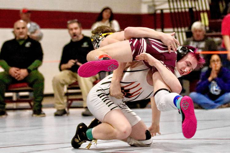 Newport High's Blake Ploss lifts Karter Morey, a Lyndon Institute student competing for St. Johnsbury Academy, during their 132-pound title match on Dec. 30, 2023, in Lebanon, N.H. Morey won, 7-1, during a 17-team tournament hosted by Lebanon High. (Valley News - Tris Wykes) Copyright Valley News. May not be reprinted or used online without permission. Send requests to permission@vnews.com.